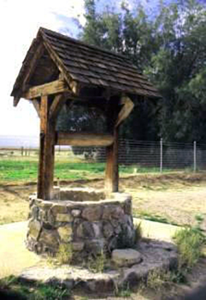 Outside well with a gable roof and post